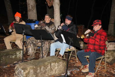 A band playing outside in the cold at Santa in the Park